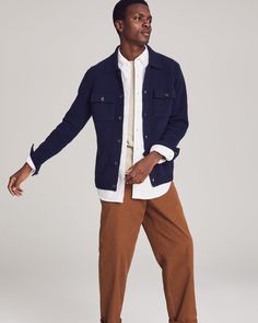 A wardrobe MVP.Crafted from luxuriously knit cashmere, this button-up shirt jacket or “shacket” features two front-flap chest pockets for a classic workwear vibe, a comfortable ribbed hem, and buttoned cuffs that allow you to roll the sleeves up or down with ease. It’s the perfect transitional piece: wear it as outerwear in spring or fall, or layer it up in winter for added warmth. Emblazoned with NOMAD1942’s insignia on the upper left sleeve, this shirt jacket proudly celebrates our New York Ci Lapel Collar Sweater With Pockets For Winter, Long Sleeve Workwear Sweater With Buttoned Pockets, Long Sleeve Sweater With Buttoned Pockets For Work, Unstructured Winter Shacket With Patch Pockets, Fall Sweater With Pockets And Lapel Collar, Long Sleeve Sweater With Pockets For Work, Classic Wool Utility Jacket With Patch Pockets, Classic Shacket With Camp Collar And Pockets, Casual Wool Outerwear With Buttoned Pockets