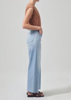 Our Lyra is a vintage inspired silhouette that sits high on the waist with an easy, relaxed top block cut with a cropped inseam with a voluminous wide leg. This fit is true to size. Looks Like: Light indigo with subtle whiskering and fadingFeels Like: Signature soft stretch denim designed to hold its shape all-day From our HUMANITY Collection Canada Goose Hat, Leather Outerwear, Cardigan Sweater Dress, Dress The Population, Norma Kamali, Denim Design, Womens Loungewear, Citizens Of Humanity, Sweater And Shorts