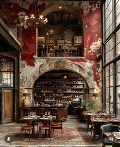 the interior of a restaurant with tables, chairs and an archway in the wall that leads to another room