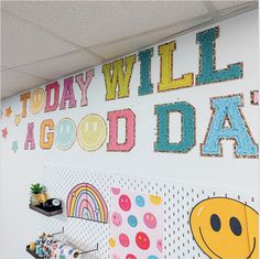 an office decorated with lots of colorful wallpaper and magnets on the walls that say today will be good day