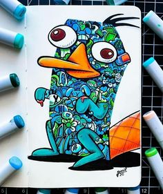 an image of a cartoon character drawn in colored pencils on paper with crayons around it