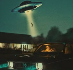 an image of a flying object in the sky above a car with a man inside