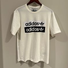 Multiple Sizes. Comment With Questions :-) Spring Adidas Logo Relaxed Fit Tops, Spring Adidas Logo Top With Relaxed Fit, Sporty Logo Print Shirt For Spring, Summer Cotton Tops With Adidas Logo, Spring Cotton Top With Adidas Logo, Casual Short Sleeve Shirt With Logo, Adidas Logo White Tops For Streetwear, Casual Adidas Logo T-shirt For Summer, White Adidas Logo Top For Streetwear