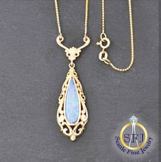 "Opal Doublet Necklace 14K Solid Yellow Gold METAL: Solid 14k Yellow Gold, Stamped 14k GEMS: 1 -- 0.92ct Opal Doublet CONDITION: Restored Vintage LENGTH: 17\" APPRAISED AT: $1,435 *You will receive the exact, one-of-a-kind item pictured.* WHAT SETS SEATTLE FINE JEWELRY APART? + Professional jeweler restored, polished, and cleaned to excellent condition. + All gems graded by GIA Graduate Gemologists. + Professional appraisal certificate included. + Generous 90-day returns & gem authenticity policy. F.A.Q. -- FREQUENTLY ASKED QUESTIONS 1) DO YOU OFFER NO-FEE LAYAWAY PLANS? Yes, we do! Just 20% down, then as many months as you need. Simply contact us to get started. 2) ARE THESE GEMS NATURAL OR LAB CREATED?  Unless otherwise noted, our gems are guaranteed to be natural, earth-mined gems as ce Hallmarked Pear-shaped Yellow Gold Necklace, Hallmarked Pear-shaped Yellow Gold Jewelry, Ornate 14k Gold Necklaces For Anniversary, Yellow Gold Pear-shaped Hallmarked Necklace, Antique Yellow Gold Teardrop Necklaces, Antique Teardrop Yellow Gold Necklaces, Antique Yellow Gold Teardrop Necklace, Classic 14k Gold Necklaces With Intricate Design, Ornate 14k Stamped Necklaces For Anniversary