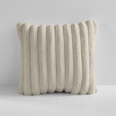 six pillows stacked on top of each other