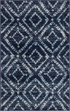 a blue and white rug with diamond shapes