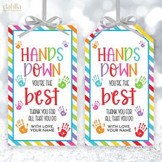 two handprinted gift tags with the words hands down, you're the best