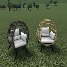 two wicker chairs sitting on top of a green grass covered field next to each other