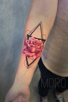 a rose tattoo on the arm with geometric shapes around it and a triangle in the middle