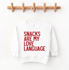 "Snacks Are My Love Language, Funny, Trendy Valentines  Shirt, Toddler Boy Sweatshirt, Valentines Shirt, Heart Throb, Mr. Steal Your Your little one will love wearing this cute Valentine's design all year long! 📋 HOW TO ORDER: 1. Select the size 2. Select the color 3. Select the quantity 4. Add personalization if required 5.Add to Cart (\"buy now\" will take you directly to checkout and \"add to cart\" will allow you to continue shopping with us) 6. Submit order (Shipping will automatically be Toddler Boys Valentines Shirt, Boys Valentines Shirts Vinyl, Little Boy Valentine Shirt, Toddler Boy Valentines Basket, Valentine’s Day Shirts For Kids, Toddler Boy Valentine Outfit, Valentines Shirts For Kids, Boys Valentine Shirts, Toddler Boy Valentines