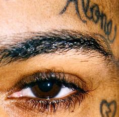 an eye with some writing on it's forehead and the words are all around