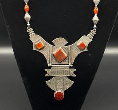 A Beautiful Afghani Red Carnelian And Silver Beads Necklace With A Silver Pendant Decorated With Carnelian Cabochons Vintage Red Necklaces With Natural Stones, Red Vintage Necklaces With Natural Stones, Red Vintage Necklace With Natural Stones, Vintage Carnelian Beaded Jewelry, Carnelian Cabochon Necklaces For Jewelry Making, Vintage Carnelian Polished Beads Jewelry, Red Carnelian Artisan Jewelry, Red Carnelian Vintage Jewelry, Artisan Red Carnelian Jewelry