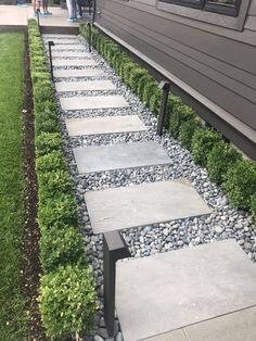 a walkway made out of stones and grass