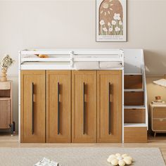 a white bunk bed sitting next to a wooden dresser in a room with beige walls