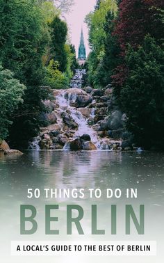 the book cover for 50 things to do in berlin, with a waterfall and church in the background