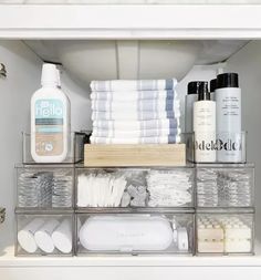 an organized bathroom cabinet filled with toiletries and personal care items