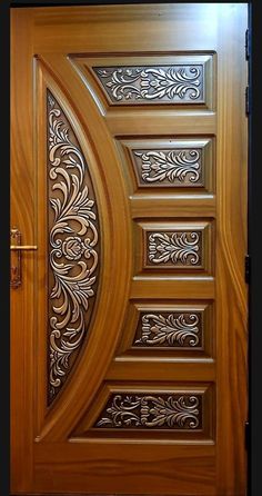 a wooden door with intricate carvings on it