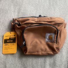 Carhartt Waist Unisex Fannypack Bag *New* Arrives New Authentic Merchandise Can Be Used For Men Or Woman Perfect For Travel (Fits Waist Size Up To 54 Inches) With A Side Release Buckle And Can Be Worn Around The Waist, Over The Shoulder As A Sling Bag, Or Across The Chest As A Cross-Body Bag Deets: 11.5x6x4.5 Inches, Weighs 0.7 Pounds, And Features Ykk Zippers And A Carhartt Logo Patch. Carhartt Bag, Travel Fits, Carhartt Cargo, Carhartt Logo, Men Carhartt, Hip Bag, Waist Pack, Carhartt Mens, Sling Bag