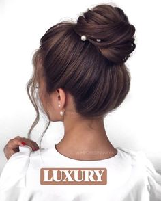 "With a high bun, your hair becomes a beacon of elegance that commands attention wherever you go."  Would say a super luxury High Bun that looks just amazingly elegant with added some white beads that give the ultimate carefree vibe to a woman on her WEDDING DAY. looks High Updo Wedding, High Bun Wedding, High Updo, Wedding Bun, Wedding Hairstyles Bridesmaid, Wedding Bun Hairstyles, Wedding Hairstyles Bride