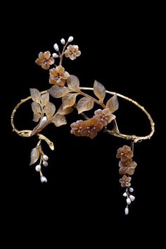 Paul Liénard, one-of-a-kind Art Nouveau tiara, c1905, with textured gold branches, carved horn leaves and apple blossoms, collet-set diamond pistils, baroque pearl buds, and suspending two detachable clusters of flowers and leaves. Known as the "Forget Me Nots" tiara. Photo Qatar Museum via Albion Art. Nouveau Flowers, Lalique Jewelry, Filipino Clothing, Bijoux Art Deco, Gold Branches, Bijoux Art Nouveau, Apple Blossoms, Nouveau Jewelry, Gold Tiara