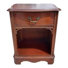 an old wooden cabinet with two drawers on one side and a drawer on the other