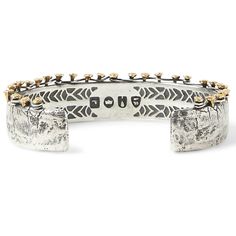 With a rugged design hand crafted from fine luxury sterling silver, the BRASS NAILS CUFF Bracelet for Men features John Varvatos signature classic meets modern style. The wide distressed silver cuff features antique brass nails 'hammered' into the top and woven with a silver wire - like a rickety old fence winding through a rural field. “My philosophy is about reaching back to move forward,” says leading menswear designer John Varvatos, and the thick width Brass Nails Cuff Mens Bracelet echoes t Nail Cuff, Silver Bracelet For Men, Brass Nails, Skull Bracelet Men, Mens Designer Jewelry, Gothic Bracelet, Black Leather Necklace, Rugged Design, Skull Bracelet