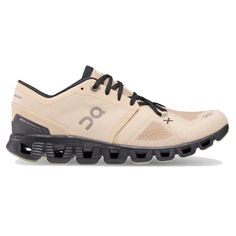 the on cloud running shoe in beige and black