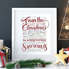 there is a christmas print on the wall next to presents and other holiday decor items