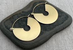 Modern geometric hoop earrings. They are simple in design but oh so eye catching and stylish! Dress them up or down. Versatile and perfect for everyday wear. The hoops measure 1 1/2" long by 1 3/8" wide. Made from stainless steel. I have this same earrings style also available in silver. Here is a direct link...https://www.etsy.com/listing/1759461080/ Thanks for stopping by! Please take a moment and visit the rest of my Etsy shop. I have many more unique jewelry pieces to choose from! Tiger Flow Minimalist Small Hoop Earrings Cadmium-free, Modern Brass Hoop Earrings, Modern Brass Hoop Earrings For Everyday, Modern Nickel-free Brass Hoop Earrings, Modern Gold Earrings, Earrings Gold Hoop, Exotic Jewelry, Geometric Hoop Earrings, Hoop Earrings Gold