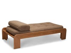 a wooden bench with two pillows on it's back and one foot resting on the seat