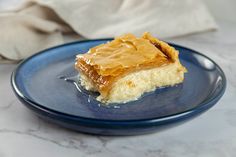 a piece of cake sitting on top of a blue plate