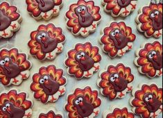 decorated cookies in the shape of turkeys with eyes