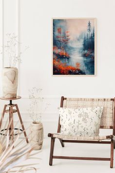 a painting hanging on the wall next to a chair