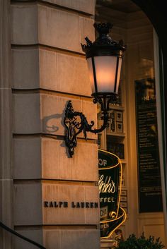 a lamp on the side of a building