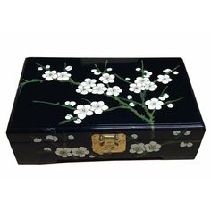 a black box with white flowers painted on it