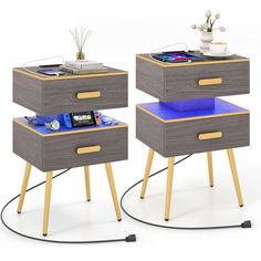 two nightstands with blue drawers and yellow legs, one has a phone on it