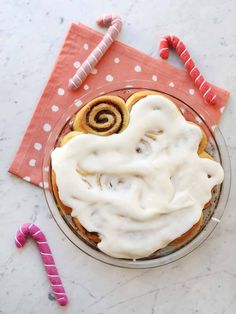 a dessert with white icing and candy canes