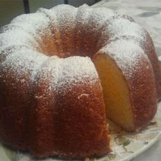 a bundt cake on a plate with powdered sugar