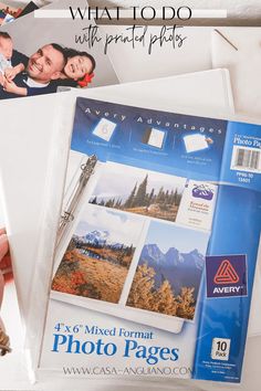 a binder that is sitting on top of a table with some pictures in front of it