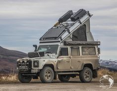 an off - road vehicle with a solar panel on the roof