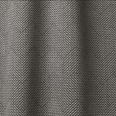 a close up view of a black and white checkered fabric with an interesting pattern