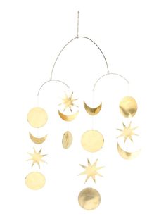 a wind chime hanging from the ceiling with stars and crescents on it's sides