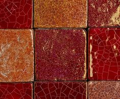 red and yellow tiles are arranged in an abstract pattern, with gold highlights on them