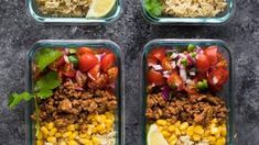 four glass containers filled with different types of food and garnished with cilantro