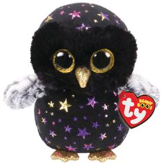 an owl stuffed animal with big eyes and stars on it's body, sitting in front of a white background