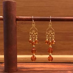 The color of these Topaz Swarovski beads echo the changing leaves of fall.  The finding are gold filled. Drop length 2 3/4 inches. Gold Copper Chandelier Earrings, Gold Copper Chandelier Earrings As Gift, Gold Copper Chandelier Earrings For Gift, Elegant Gold Crystal Earrings With Dangling Beads, Gold Long Drop Chandelier Earrings Nickel Free, Gold Nickel-free Long Drop Chandelier Earrings, Elegant Chandelier Earrings With Czech Glass And Dangling Beads, Gold Beaded Long Drop Earrings, Handmade Gold Dangle Chandelier Earrings