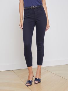 Our coveted Margot silhouette cut from lightweight, ultra-soft modal for unmatched comfort. Tonal stitching and matte black button closure blend into the dark indigo fabric for a seamless effect. Tapered leg hugs from hip to ankle, while the contoured waistband defines and slims the natural waist. | L'AGENCE Margot Skinny Jean In Metro Great Neck New York, Classic Blues, Matte Black Hardware, Indigo Fabric, Dark Indigo, Blue Pants, Silhouette Cut, Black Hardware, Black Button