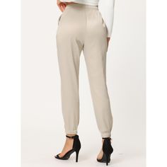 The pants take on a relaxed silhouette for the new season, with sports tailoring with tassel decor giving it a new fashionable elevated twist. Soft satin shapes the stylish pants with an elasticized, drawstring waist and straight legs. An ankle-length and a high-waisted further the cool style of the satin pants that are right for work and any casual occasion. Pair with the matching top for a complete look! Spring Ankle-length Drawstring Joggers, Spring Drawstring Ankle-length Joggers, Spring Ankle-length Joggers With Drawstring, Ankle-length Workwear Joggers, Chic Joggers With Elastic Waistband For Spring, Chic Spring Joggers With Elastic Waistband, Spring Ankle-length Workwear Joggers, Spring Workwear Ankle-length Joggers, Satin Joggers