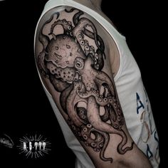 an octopus tattoo on the arm and shoulder