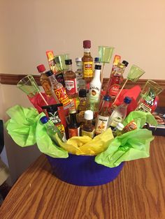 a blue bowl filled with lots of condiments on top of a wooden table